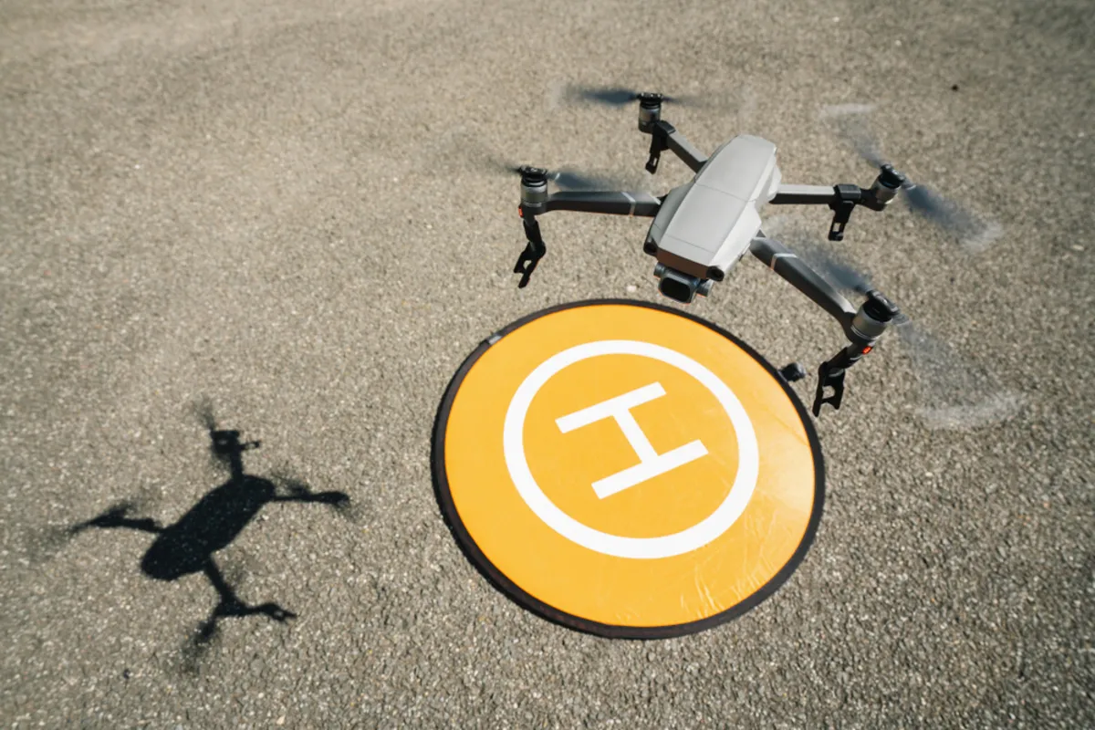 The drone lands on the yellow landing pad | Skylum Blog