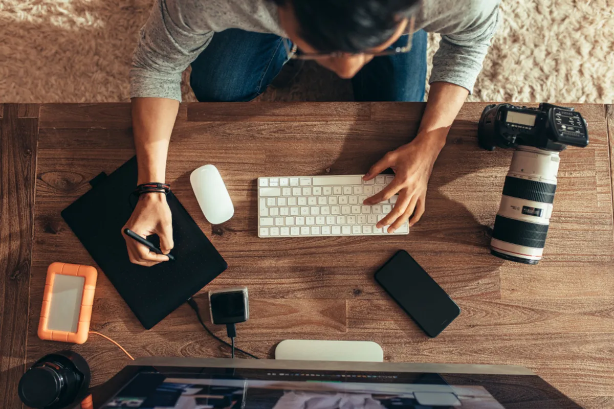 Photographer edits photo | Skylum Blog