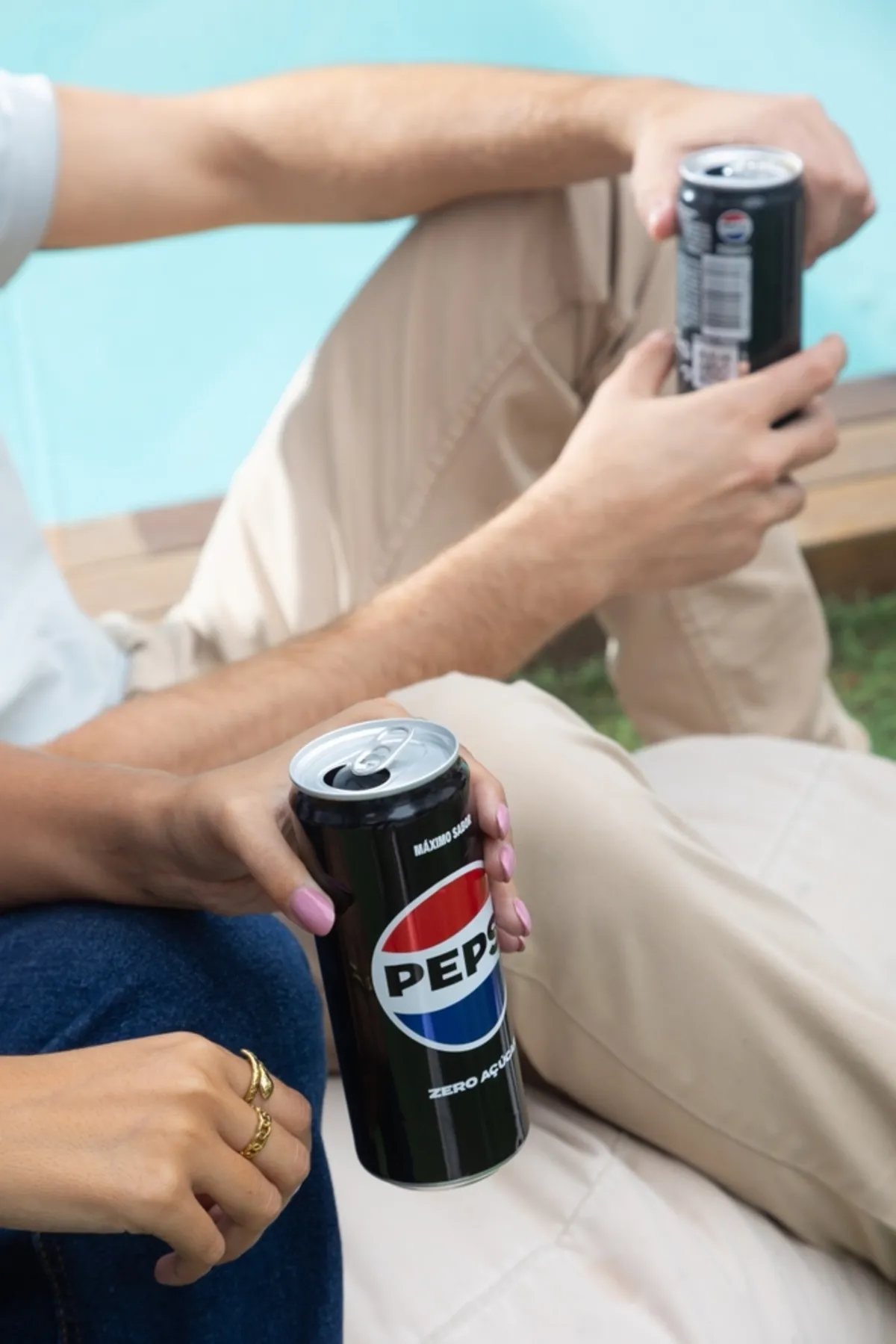 Photo of Pepsi cans in hands | Skylum Blog
