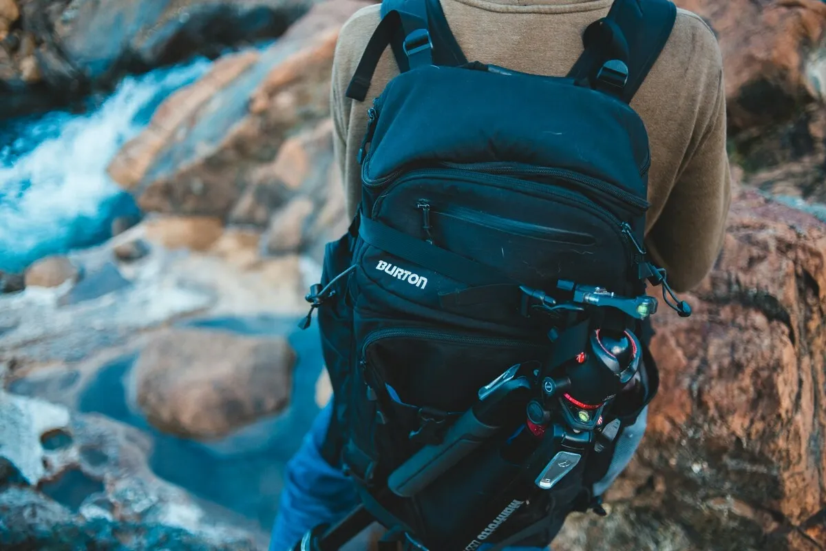 Photographer with a backpack in nature | Skylum Blog