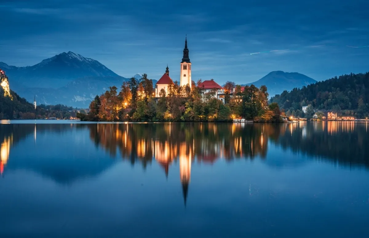 A castle in the middle of a river at blue hour | Skylum Blog