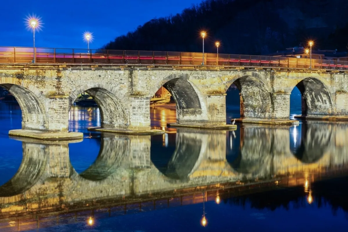 Photo of the reflective bridge at night | Skylum Blog