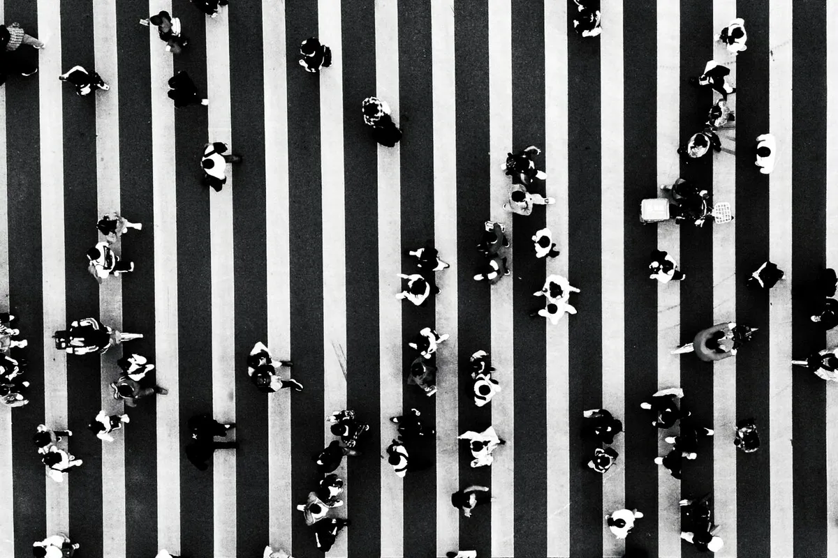 A photograph of a pedestrian crossing with people from above | Skylum Blog