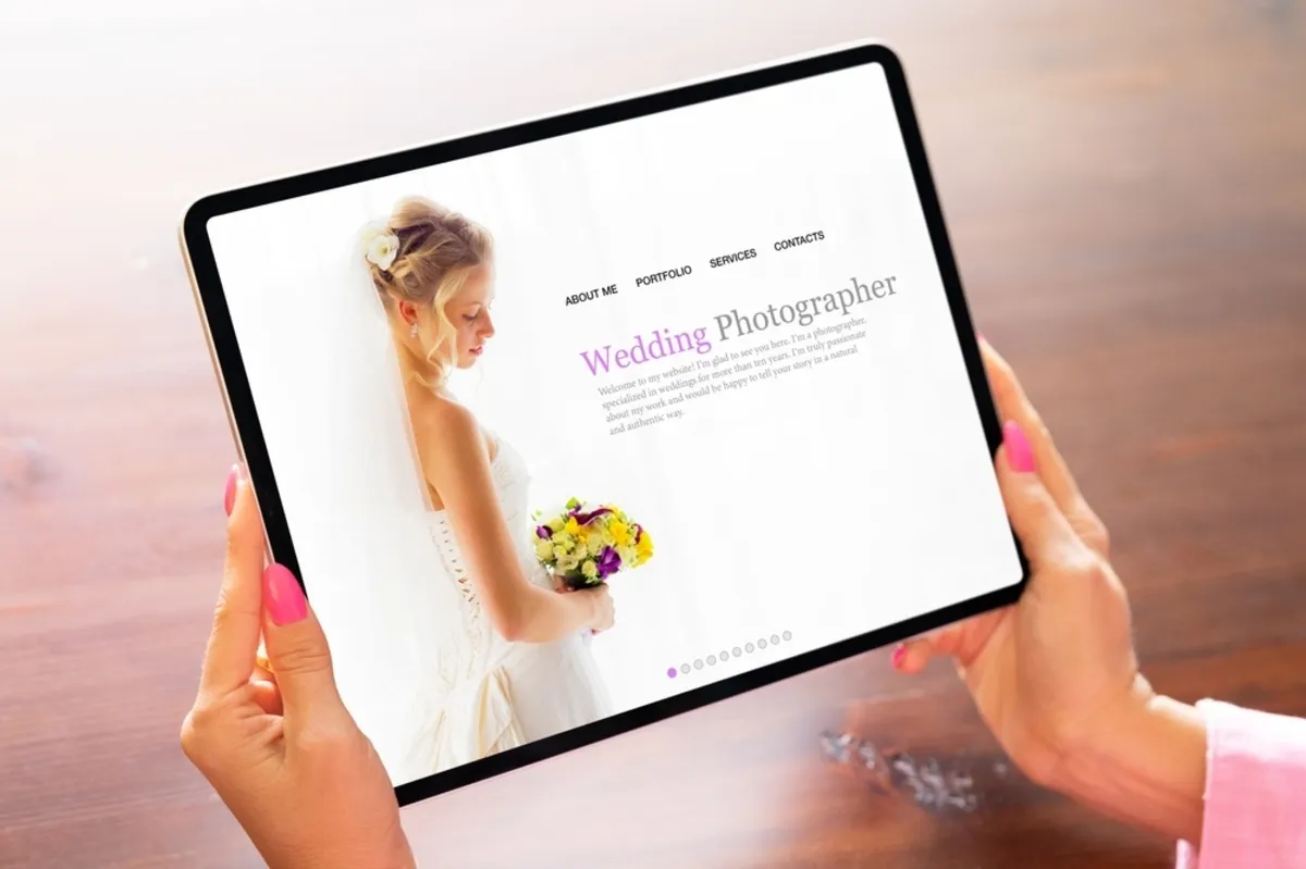 A girl looks at a photographer's website on a tablet | Skylum Blog