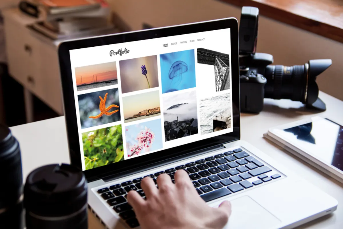 Photographer portfolio on laptop | Skylum Blog