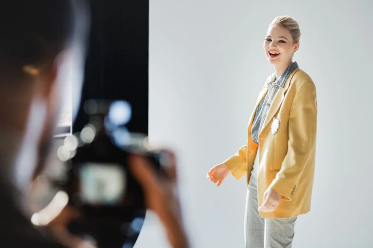 Model poses for a photographer | Skylum Blog