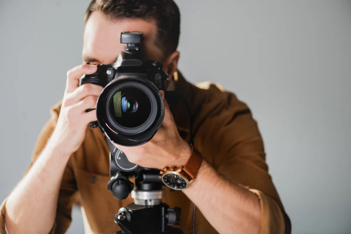 A camera in a person's hands | Skylum Blog