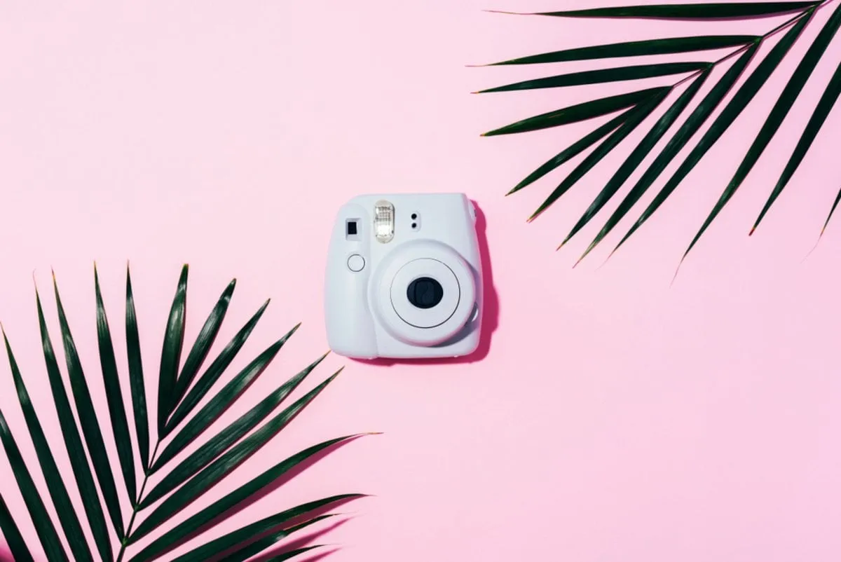 Instant print camera on a beautiful background | Skylum Blog