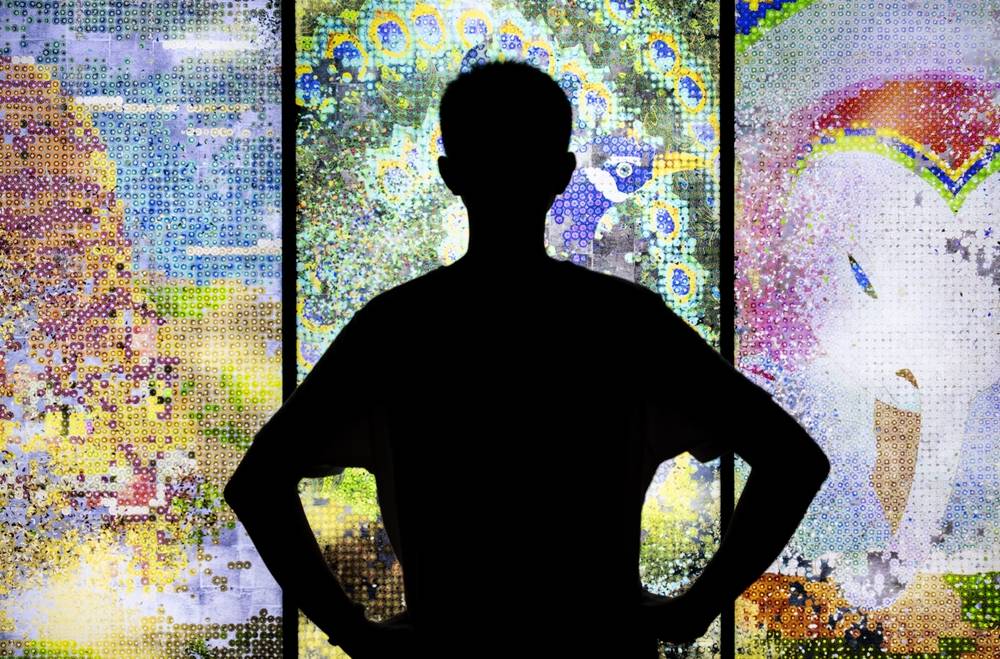 Silhouette of a person against stained glass | Skylum Blog

