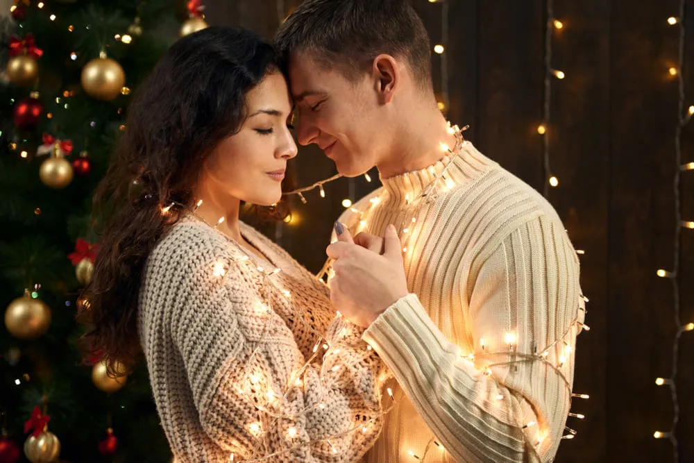 Romantic Couple Entangled in Christmas Lights | Skylum Blog