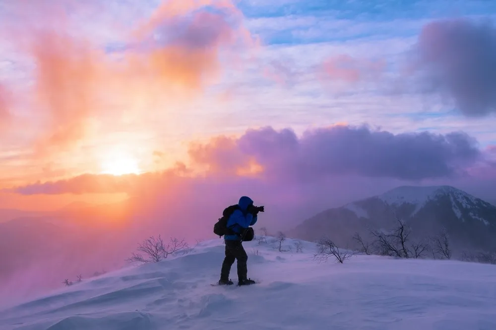Photographer in Gear Capturing a Winter Landscape | Skylum Blog