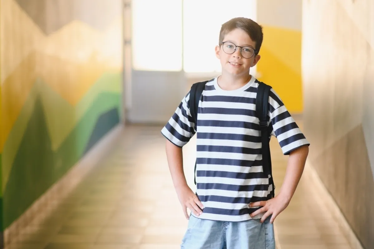 Schoolboy in a bright corridor | Skylum Blog
