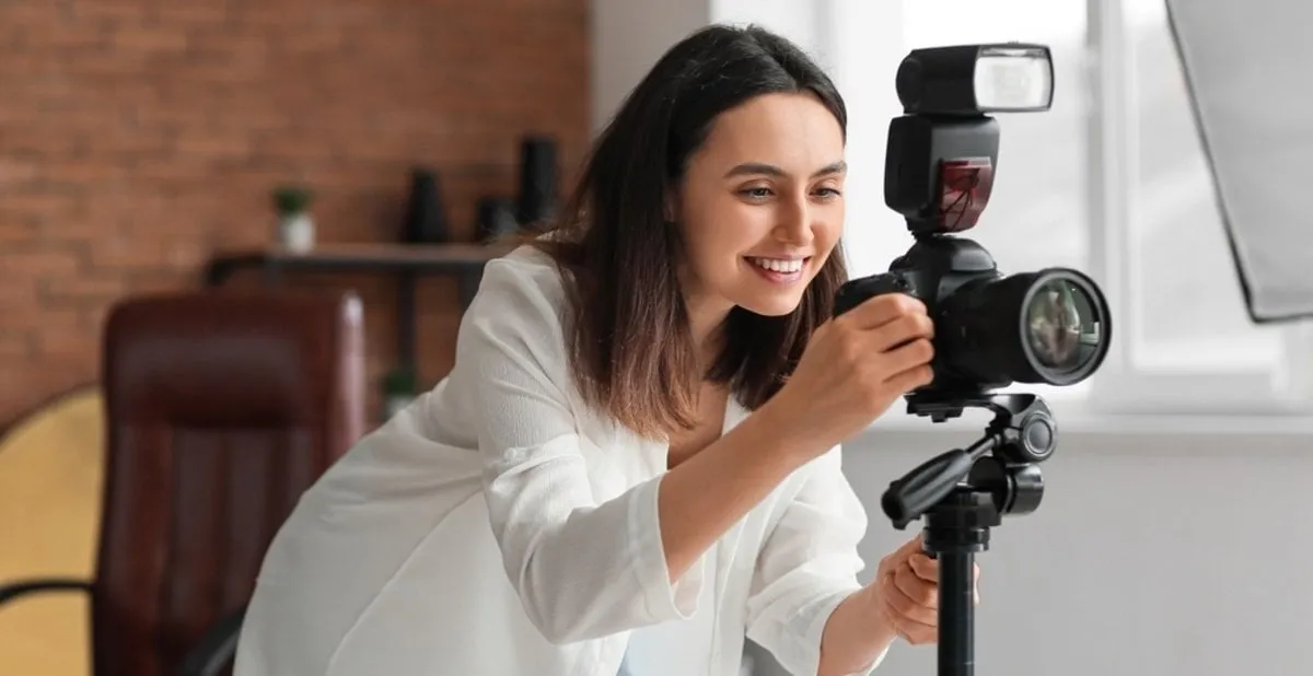 Photographer with camera indoors| Skylum Blog