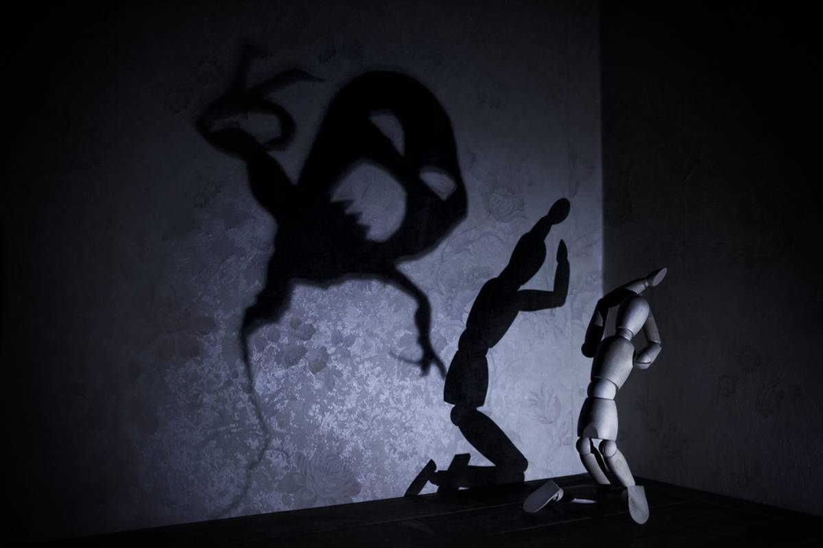 Dark puppet-like shadows against a black background | Skylum Blog

