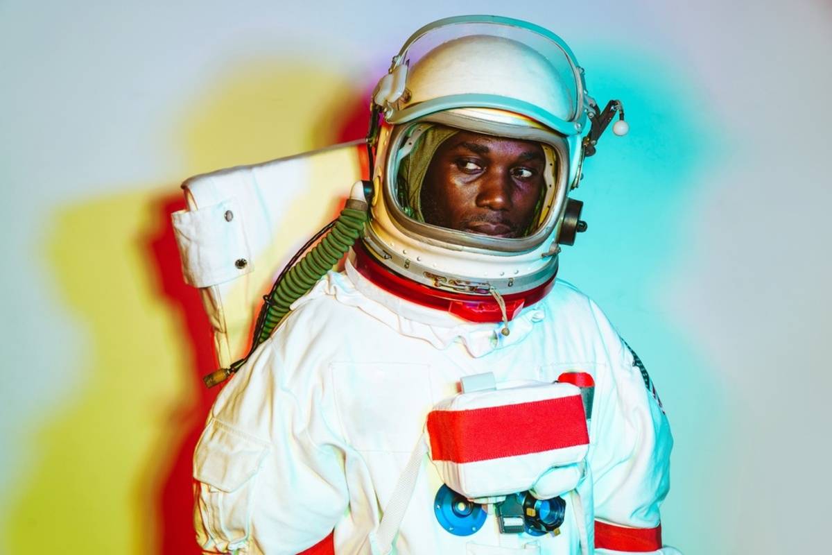 Astronaut illuminated by colorful lighting | Skylum Blog

