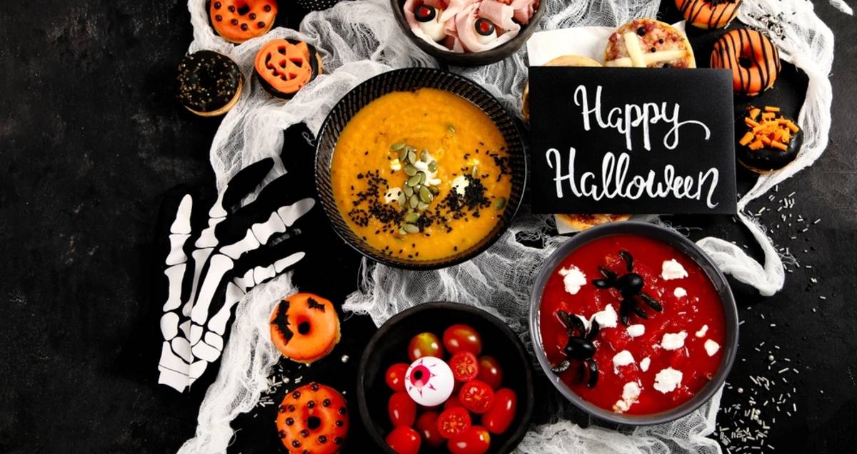 Halloween snacks and drinks arranged on a dark table | Skylum Blog

