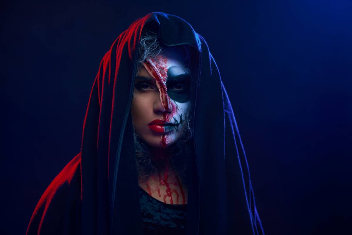 Woman with dark hair illuminated by blue and red light | Skylum Blog

