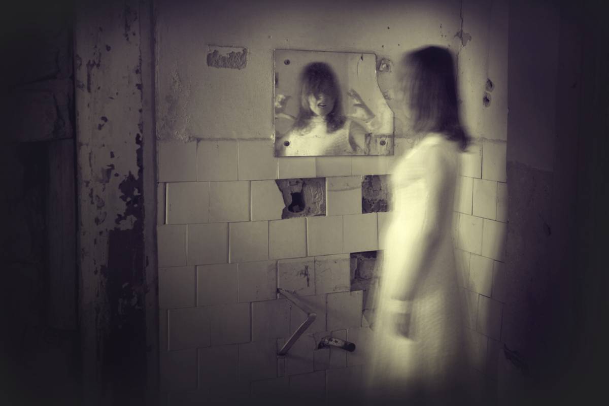 Shadowy figure reflected in an old mirror | Skylum Blog

