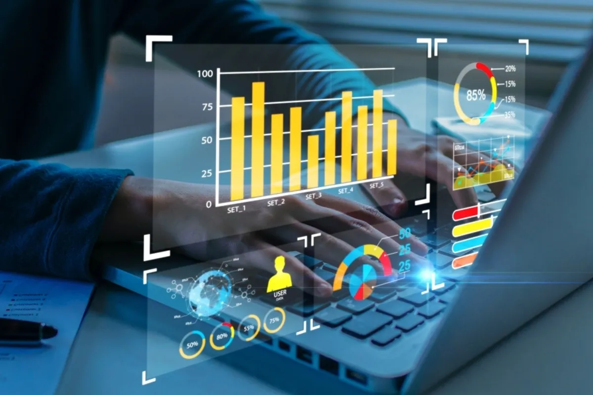A man at a computer studying graphs | Skylum Blog