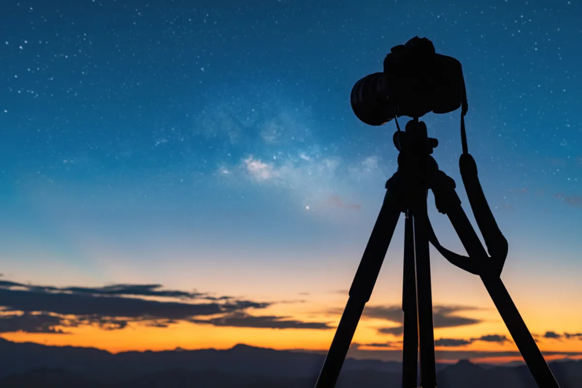 Camera on a tripod at night | Skylum Blog