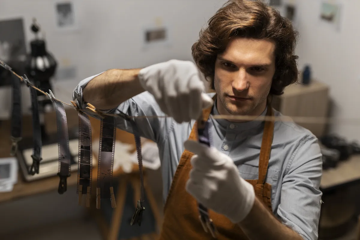 Photographer in mittens hangs film | Skylum Blog