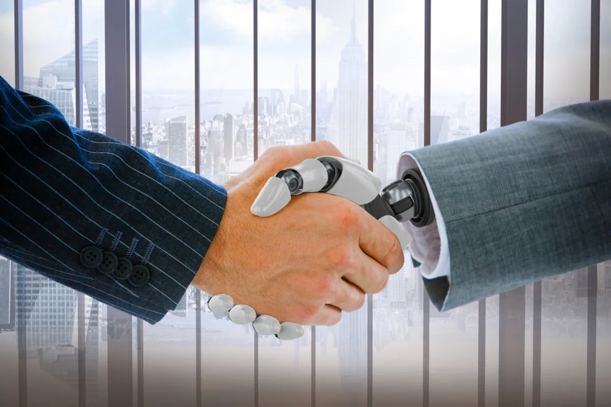 A man shakes hands with a robot | Skylum Blog