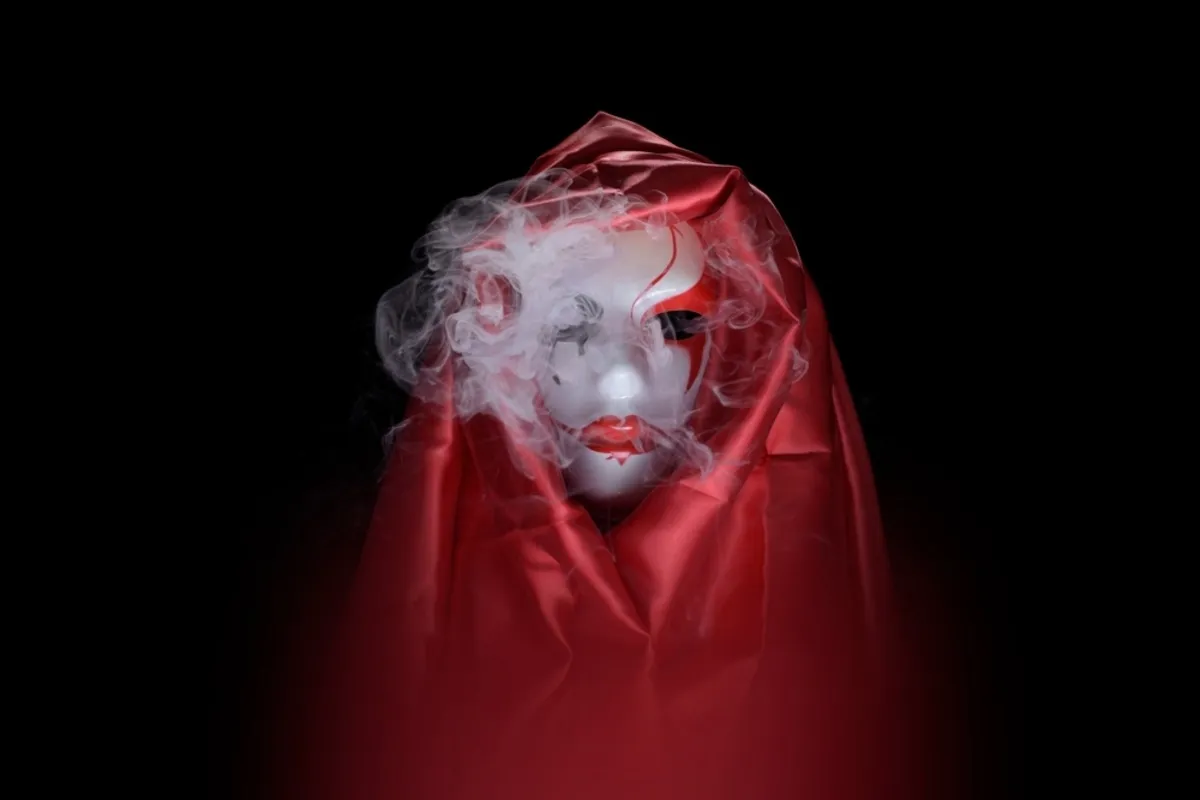 Mask in smoke and red cloak | Skylum Blog