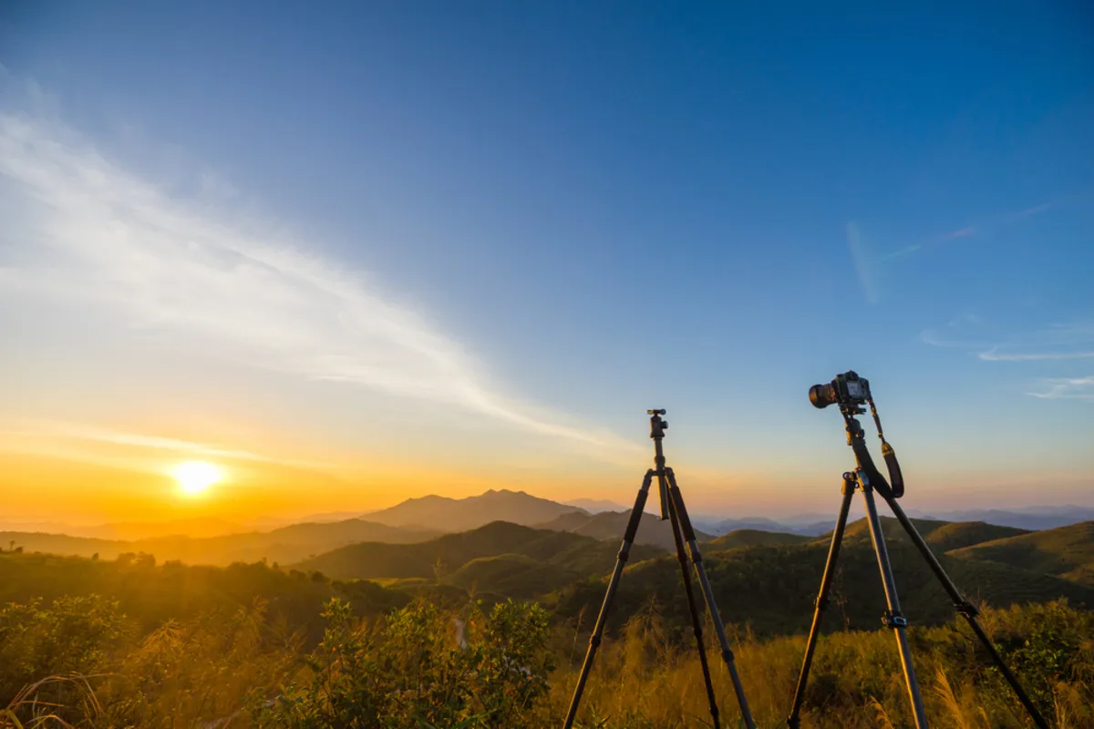 Camera on a tripod at dawn | Skylum Blog