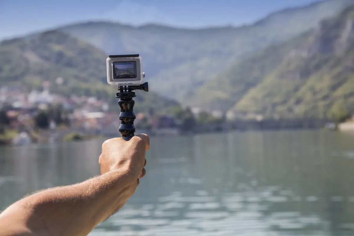 Go Pro in the guy's hands | Skylum Blog