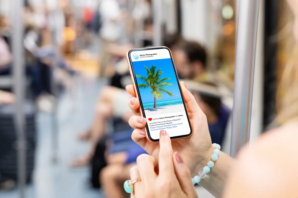 A girl looks at a post on Instagram | Skylum Blog