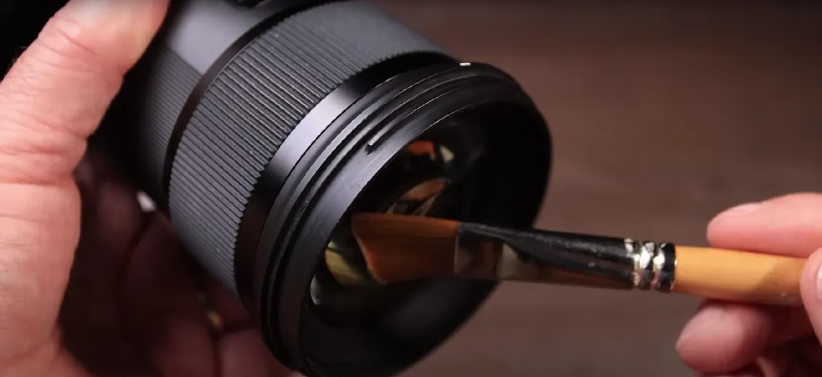 Cleaning the front of the lens with a brush | Skylum Blog
