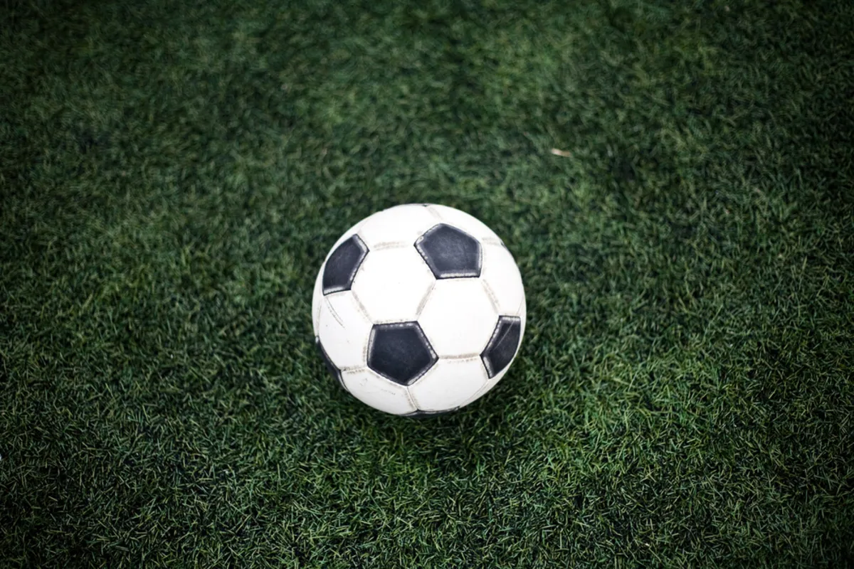 Soccer ball on grass with vignette effect | Skylum Blog
