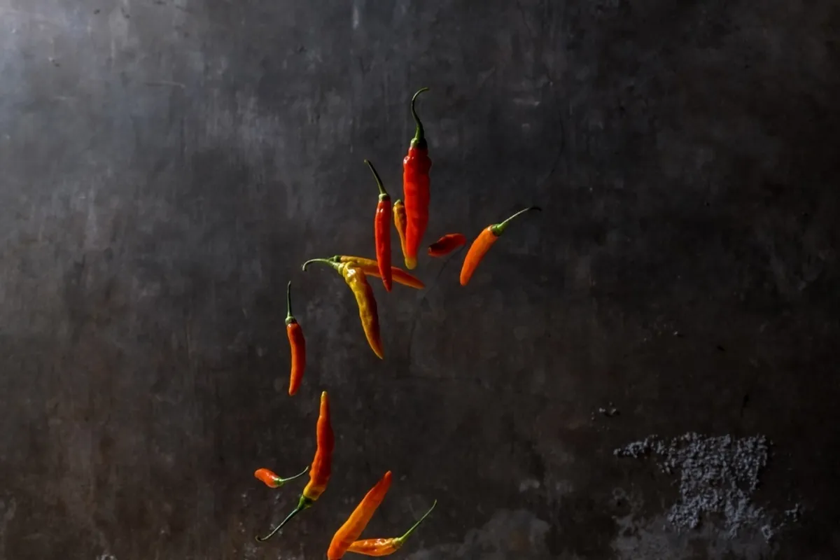 A still photo of peppers in the air | Skylum Blog