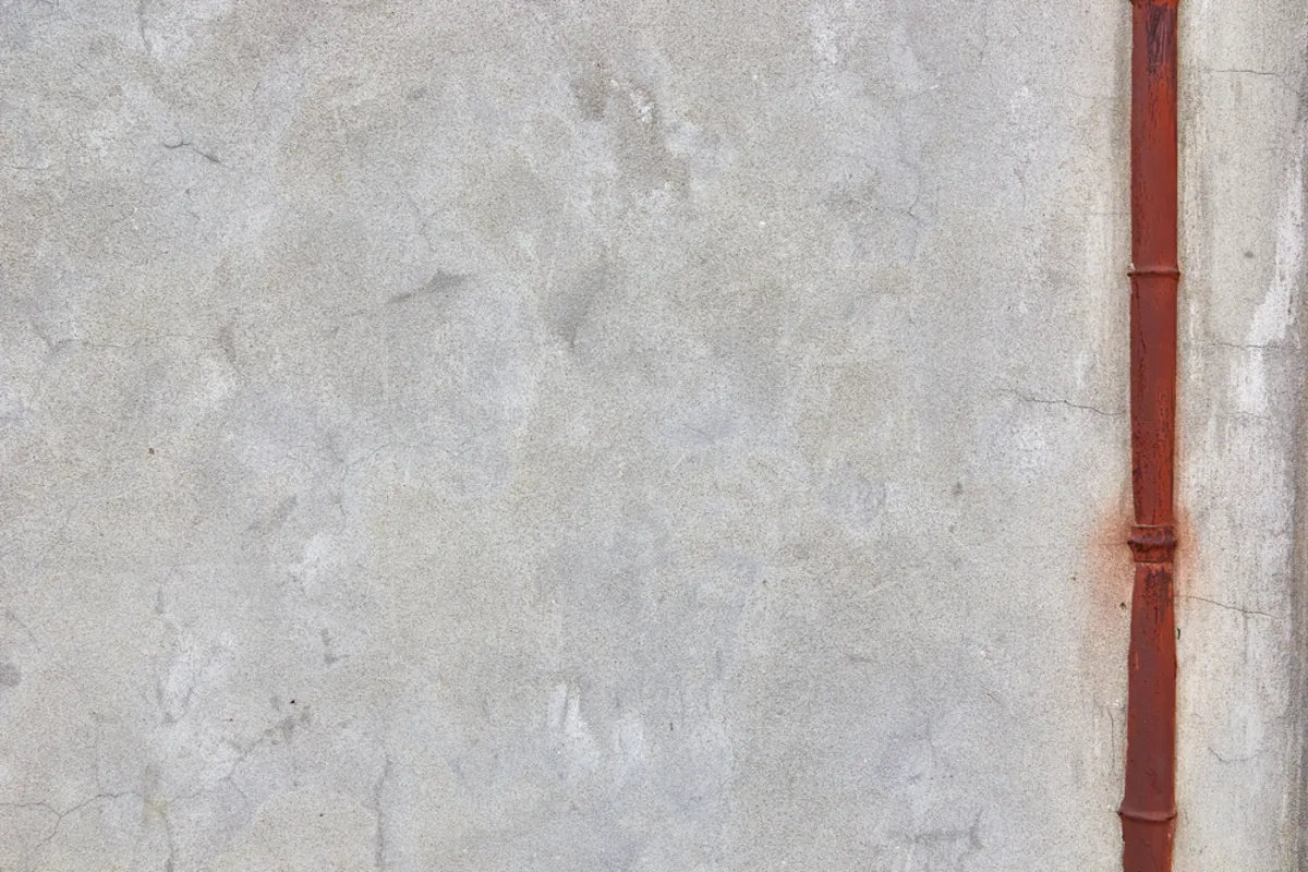 Abstract photo of a wall and a rusty pipe | Skylum Blog