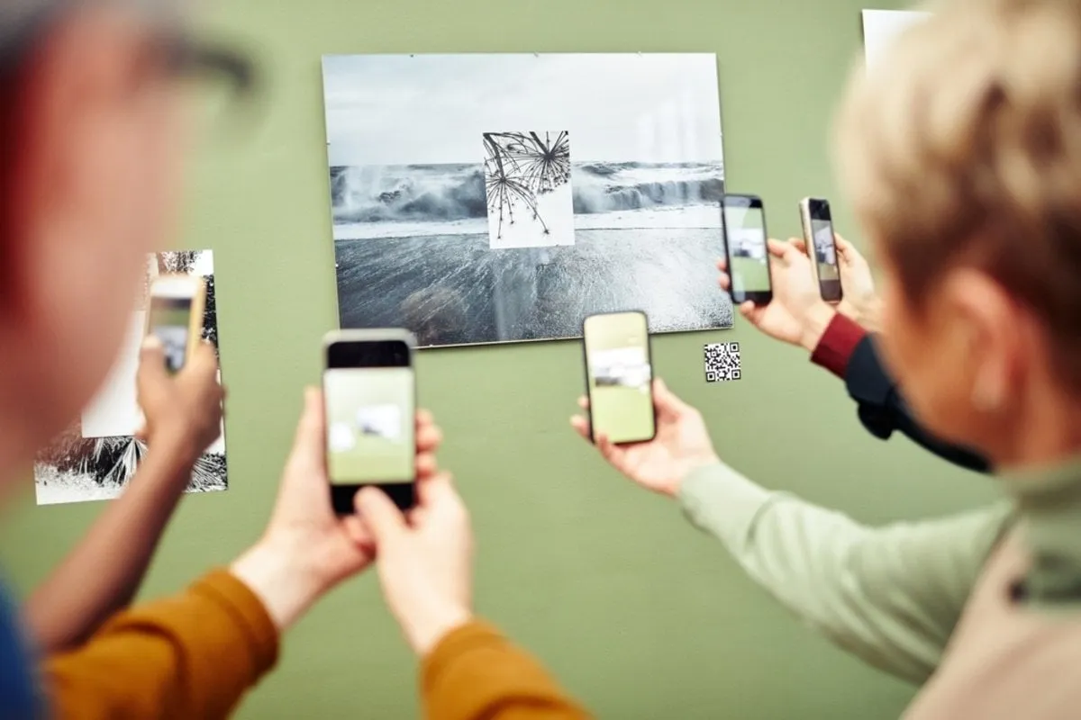 People scan the QR code next to a photo  | Skylum Blog
