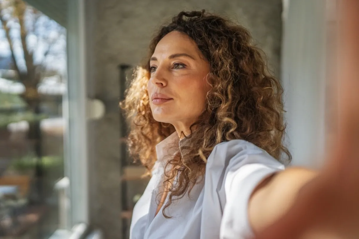 Selfie of a girl looking into the distance | Skylum Blog