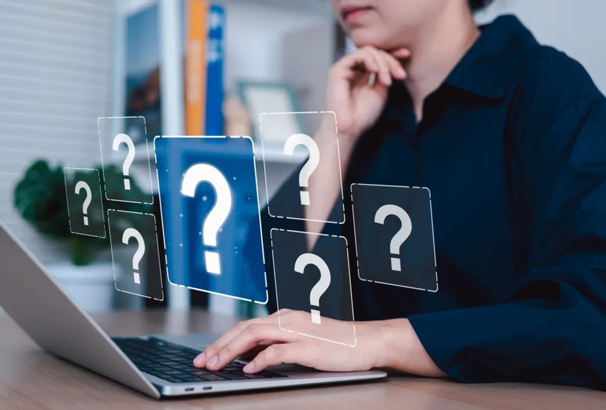 Question marks hovering over a laptop | Skylum Blog