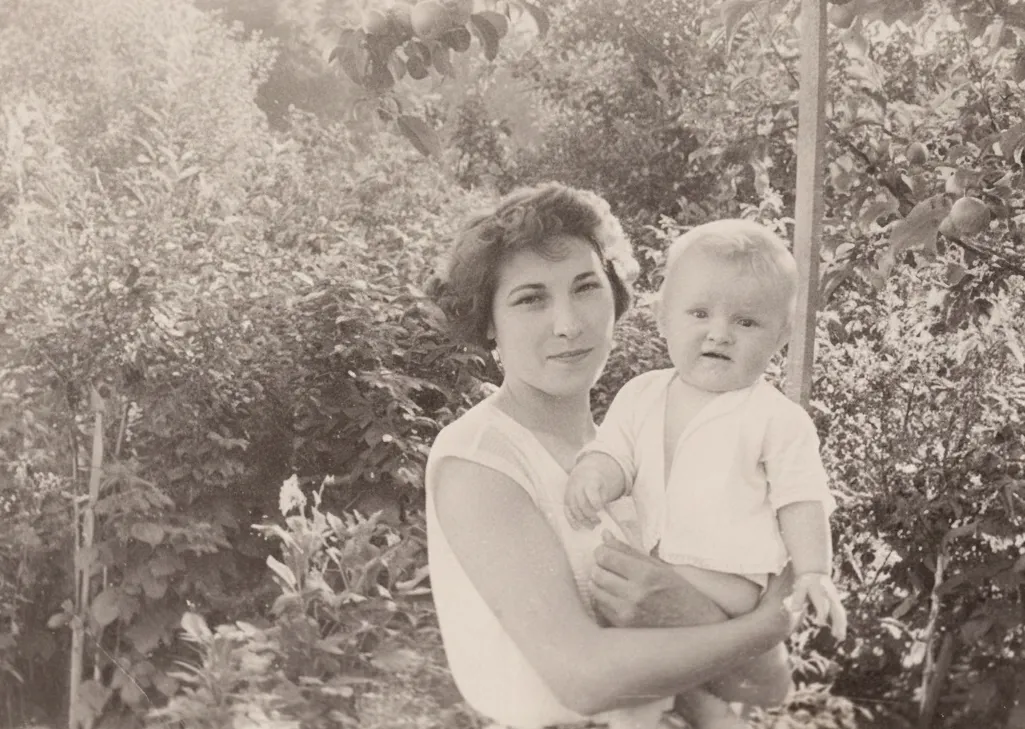 An old photograph of a mother with a child after | Skylum Blog