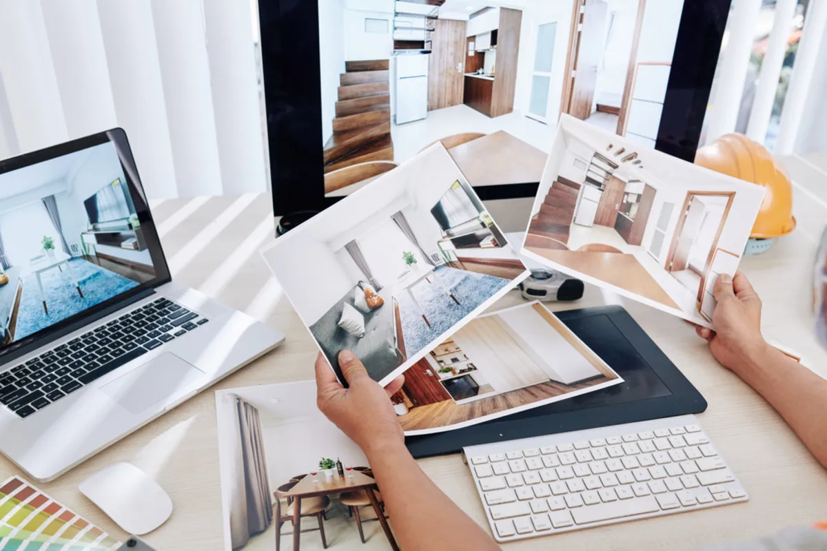 Photos of real estate on a table and on a laptop screen | Skylum Blog
