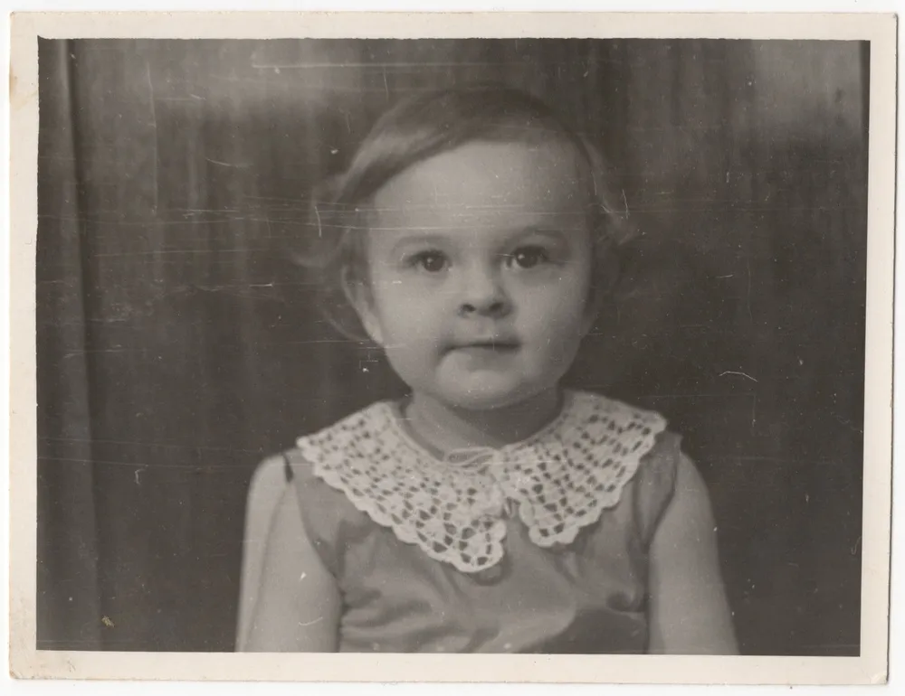 An old photo of a girl before editing | Skylum Blog