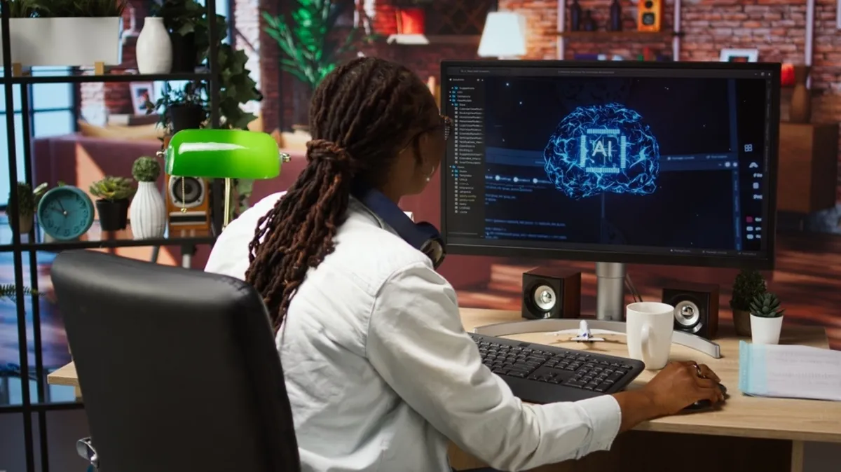 Girl at the computer with AI | Skylum Blog