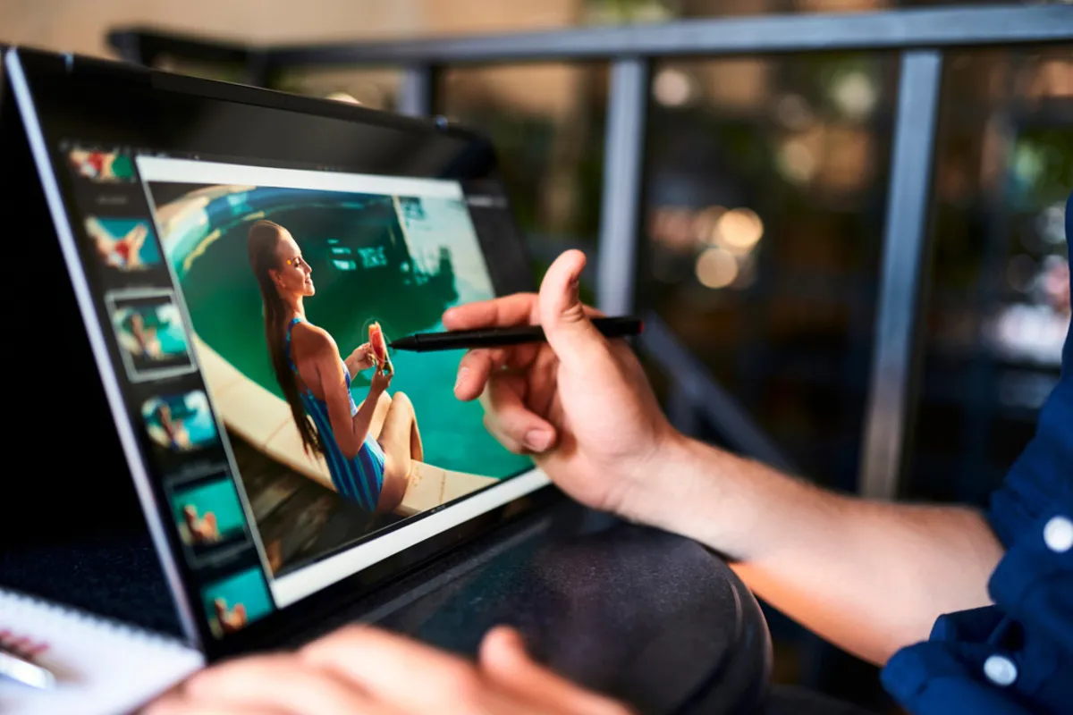 A photographer edits photos on a tablet | Skylum Blog