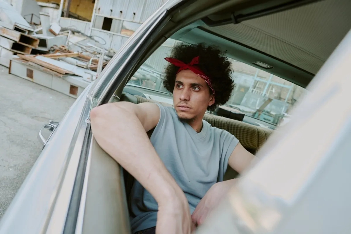 Photo of a guy in a car with a tilt | Skylum Blog