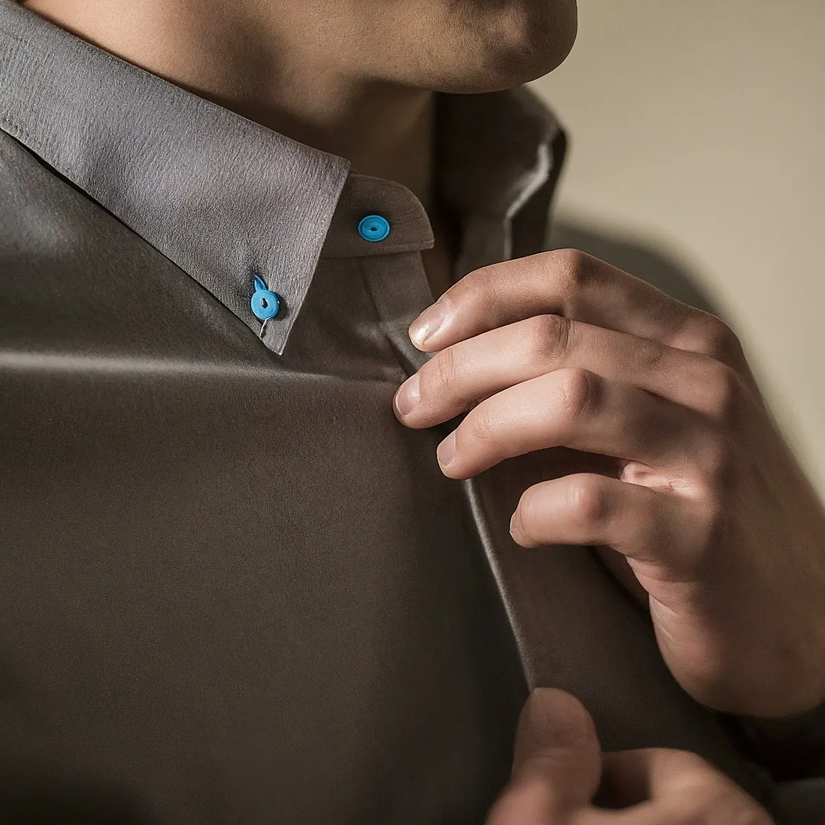 A close-up photo of a button-down shirt in AI | Skylum Blog