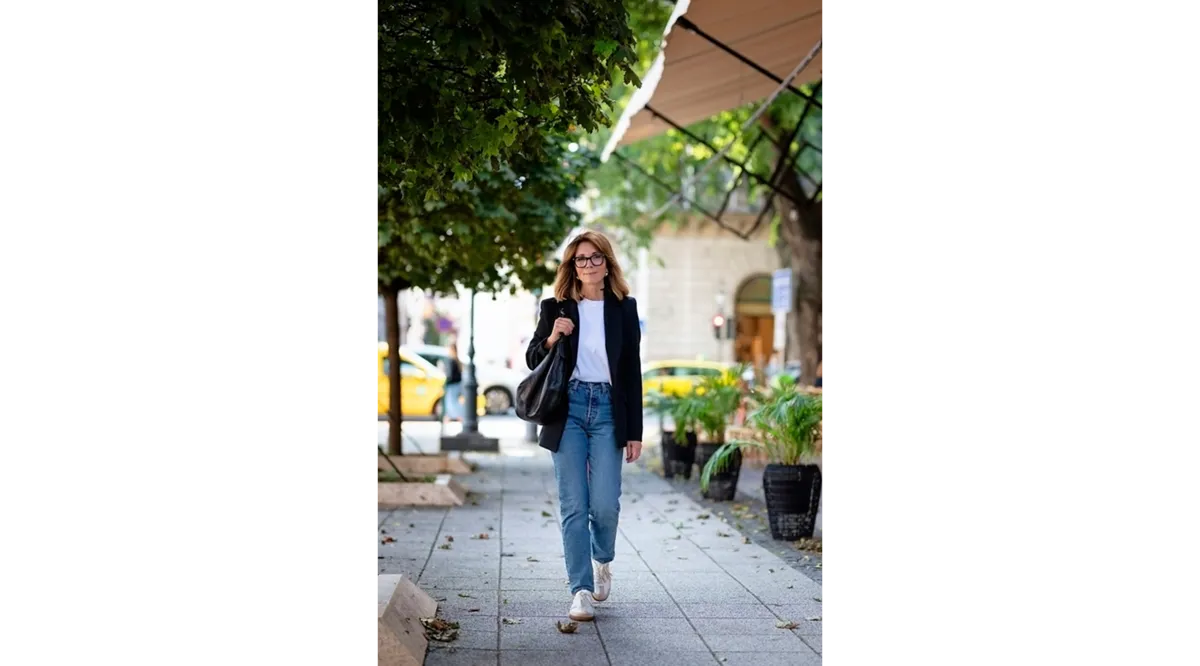 A photo of a woman walking down the street | Skylum Blog
