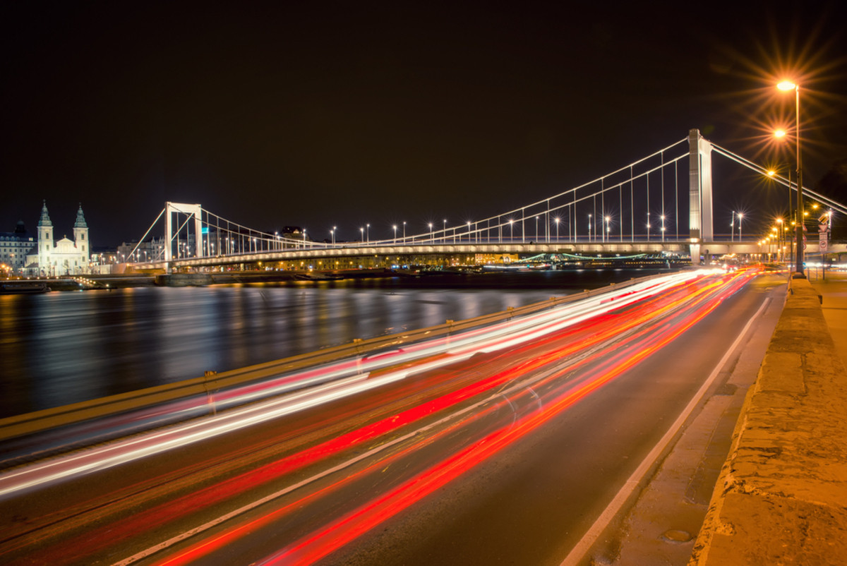 Dynamic light trails on a bridge with diagonal lines | Skylum Blog

