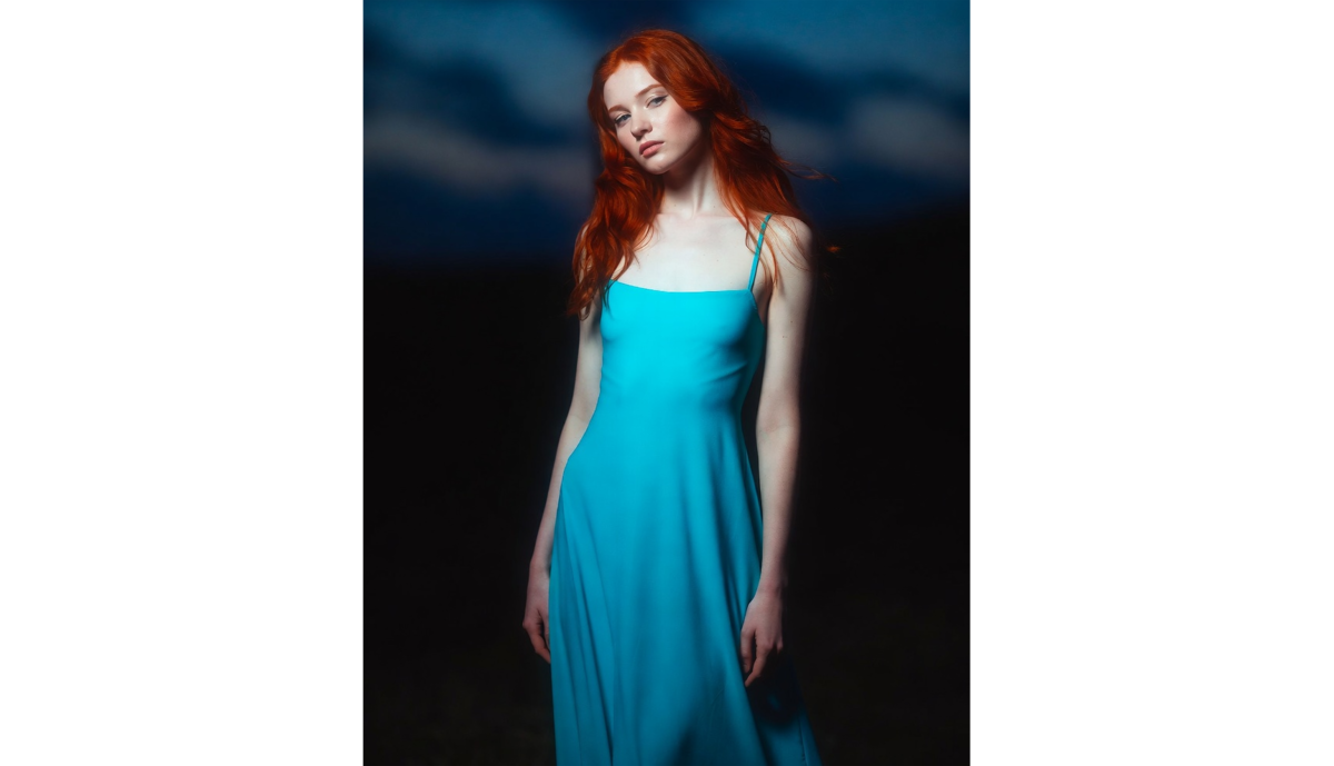 Red-haired girl in a blue dress | Skylum Blog