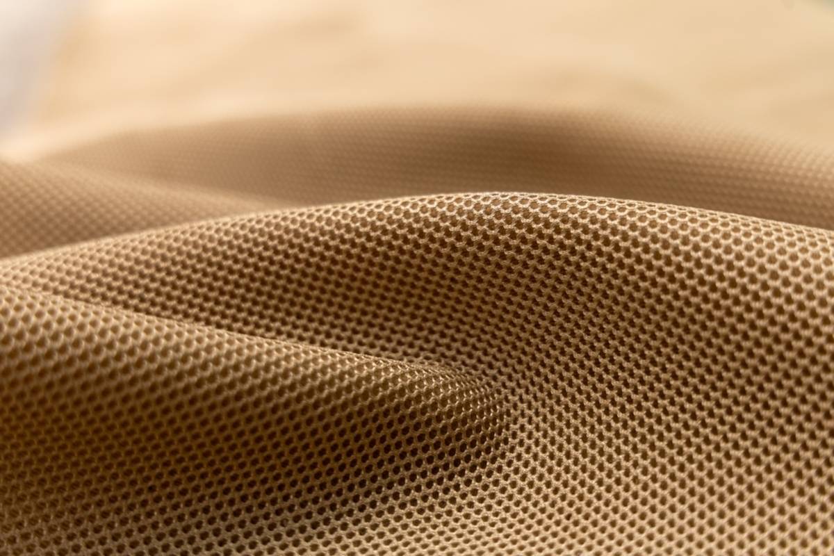 Macro shot of folded beige fabric with fine weave | Skylum Blog

