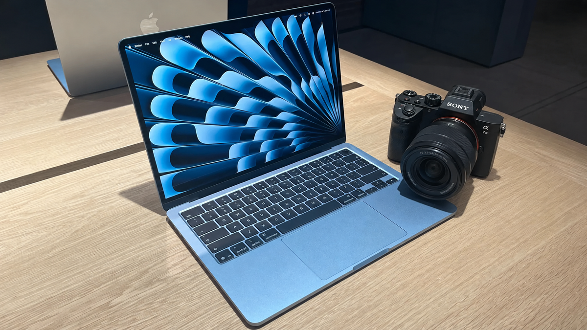 MacBook Air M5 with a camera on a table | Skylum Blog

