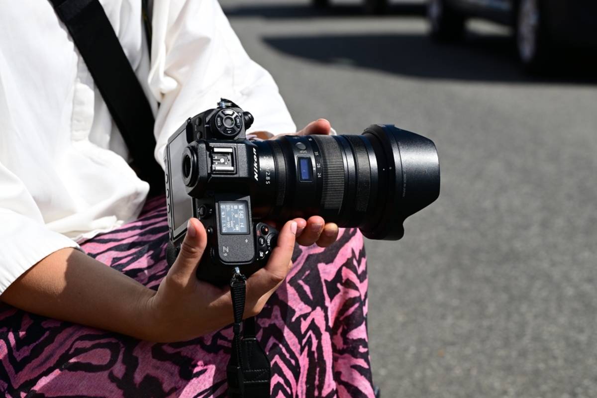 A girl holds a Nikon Z8 in her hands | Skylum Blog

